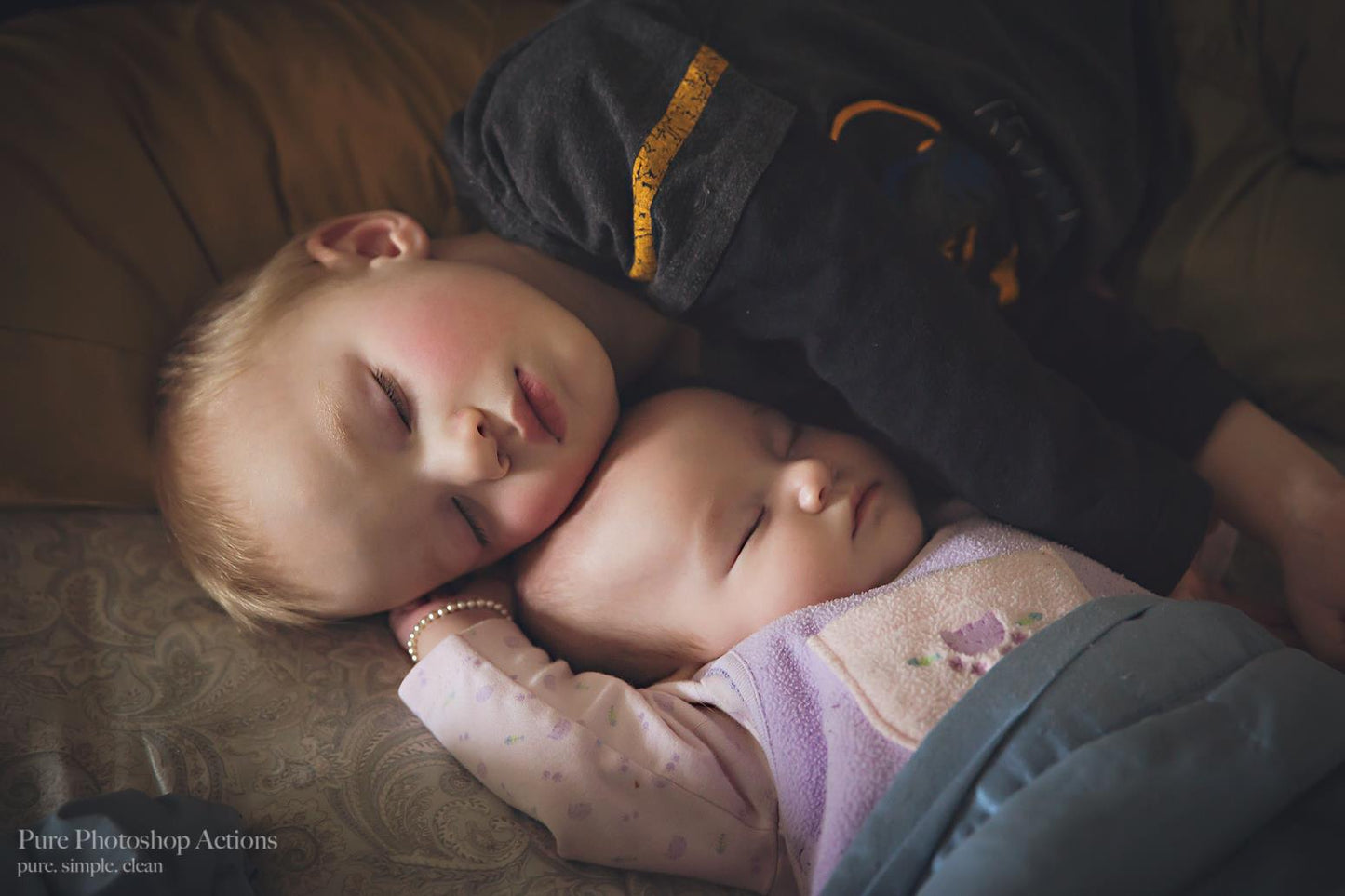 A image of a baby brother and sister asleep edited using Pure Artistic Matte Photoshop Actions.