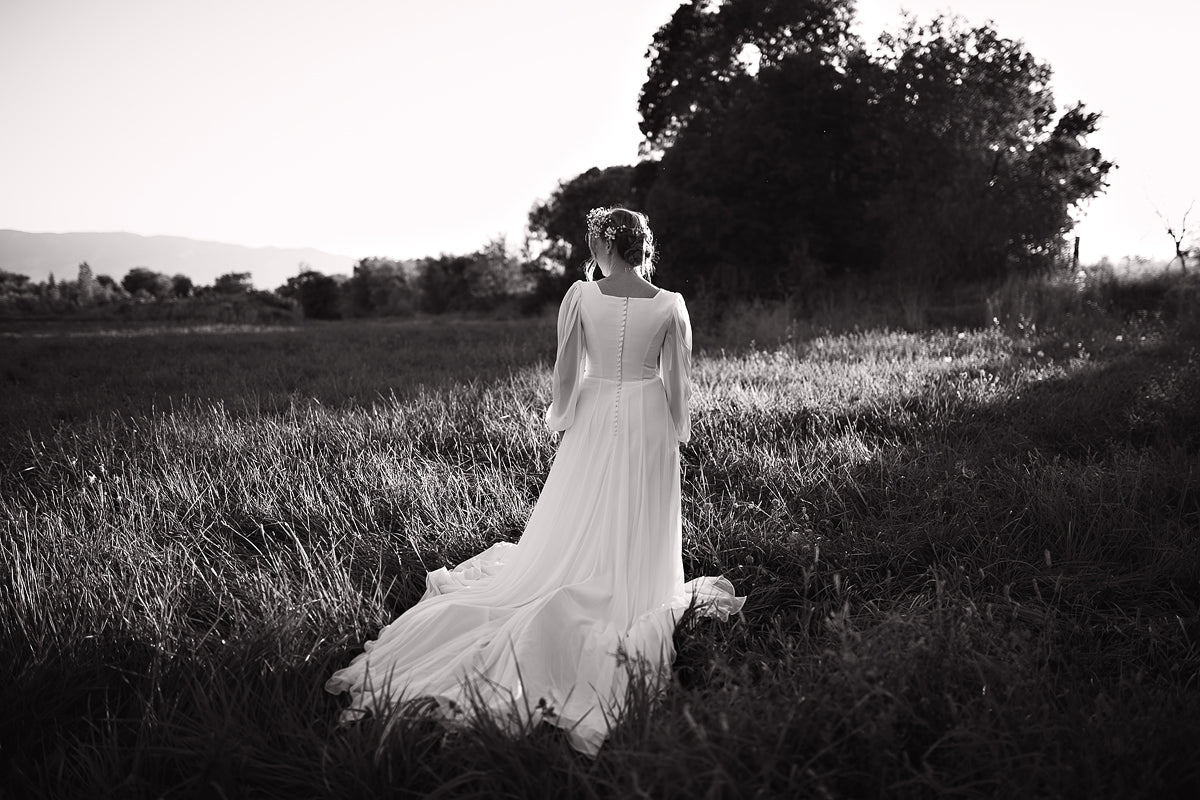 Freebie Lightroom Presets and Lightroom Profiles Free used to edit the image of a bride standing in black and white.