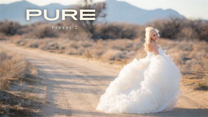An image of a bride in a fluffy dress walking down a dirt road edited using Pure Lightroom Presets 2 .