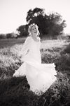 Freebie Lightroom Presets and Lightroom Profiles Free used to edit the image of a bride laughing in black and white.