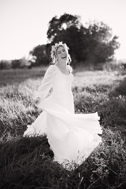 Freebie Lightroom Presets and Lightroom Profiles Free used to edit the image of a bride laughing in black and white.