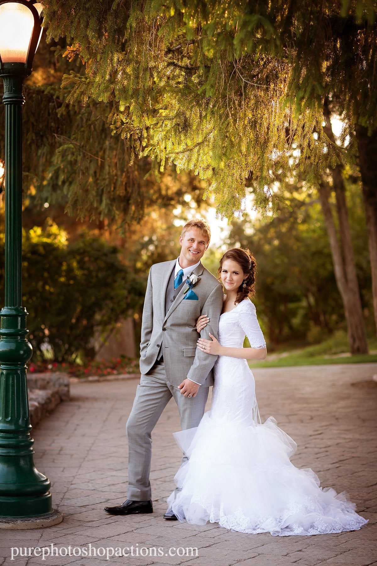 An image of a bride and groom standing on a cobblestone path edited using Pure Essential Edit Photoshop Actions and Lightroom Presets.