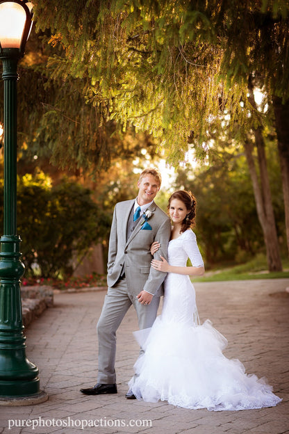 An image of a bride and groom standing on a cobblestone path edited using Pure Essential Edit Photoshop Actions and Lightroom Presets.