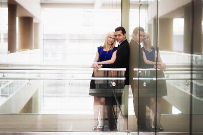 An image of a couple in a library edited using Pure Essential Edit Photoshop Actions.