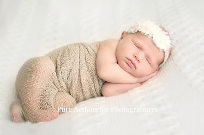 An image of a newborn baby on a white blanket edited using Pure Essential Edit Photoshop Actions and Lightroom Presets.