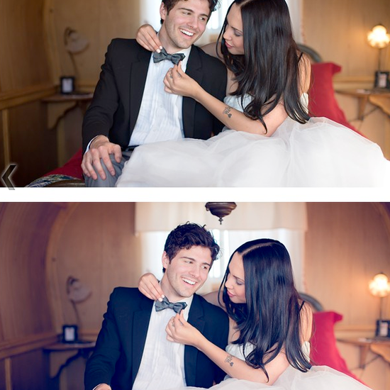 An image of a bride and groom sitting on an old fashioned sofa with the bride straightening the groom's tie.  Edited using Pure Lightroom Presets set 2.