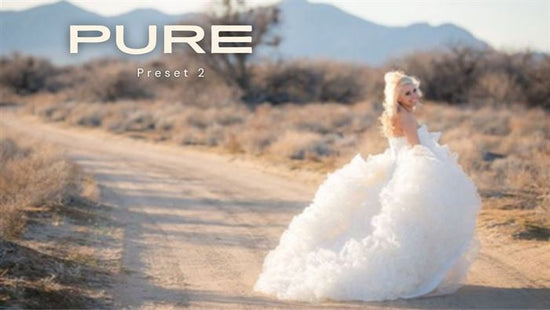 An image of a bride in a fluffy dress walking down a dirt road edited using Pure Lightroom Presets 2 .