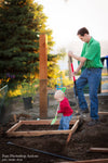 A Father and his son both digging in dirt with shovels, building garden boxes.  The after image has much more pop and contrast and color glows compared to the before action.  Edited with Pure Summer Photoshop Actions and Lightroom Presets.