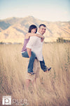 A Vintage toned image of a couple in a dreamy mountain and fieldl location edited using Purely Vintage Photoshop Actions.