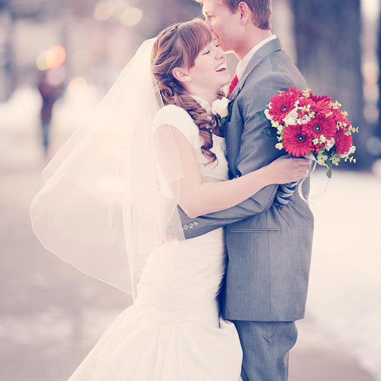 A Vintage toned image of a wedding couple in a dreamy winter location edited using Purely Vintage Photoshop Actions.