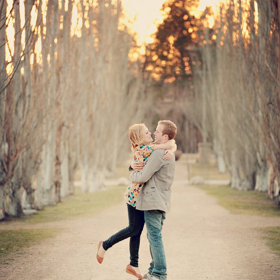 A Vintage toned image of a couple in a dreamy location edited using Purely Vintage Photoshop Actions.