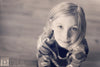 A black and white image of a young girl with a cool brown pink vintage tone from the Purely Vintage Photoshop Action Set.
