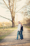 A Vintage toned image of a couple in a dreamy country road location edited using Purely Vintage Photoshop Actions.